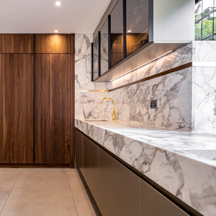 Full height cabinetry in a warm walnut canaletto is the perfect balance with the Italian marble worksurfaces | Fontana journal | Italian luxury kitchen by Fontana London | Design as Art